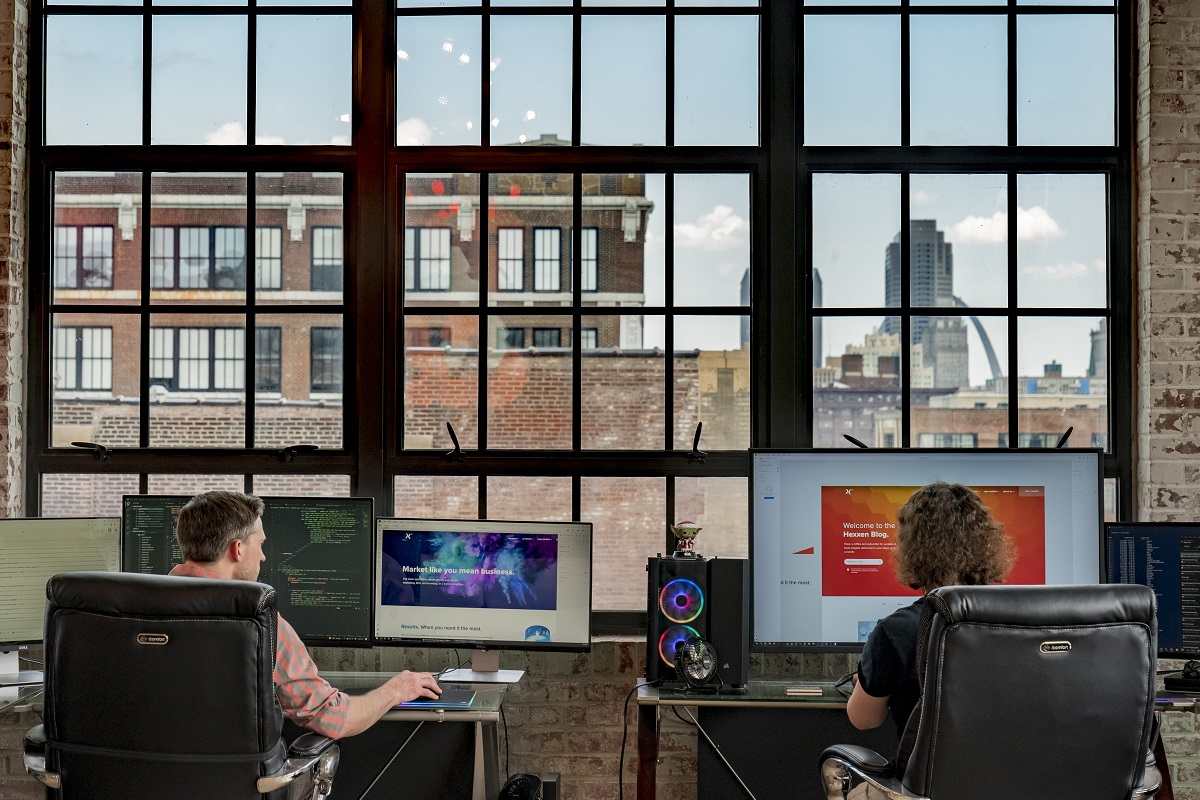 Two St. Louis Web Design Company employees setting up hosting for a client website.